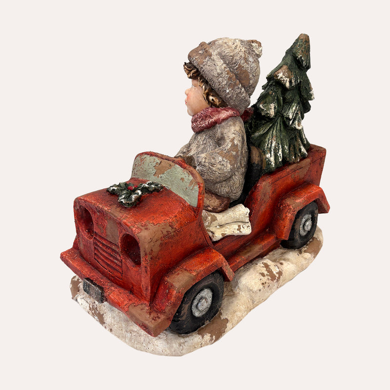 Bimbo con Macchina in Resina – Figurina Natalizia decorativa