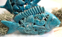 Pesce portacandele in ceramica azzurra, altezza cm 20